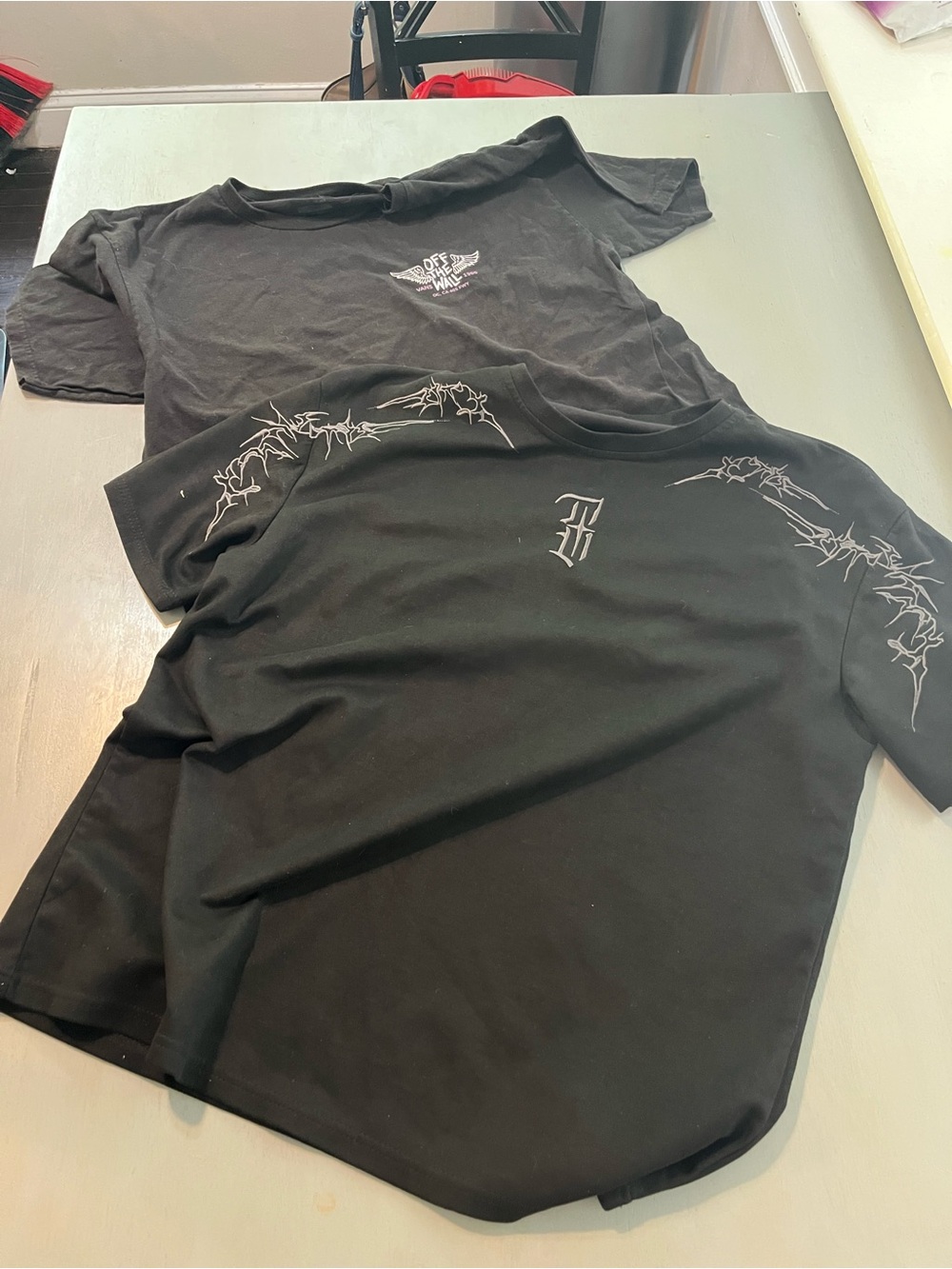 Lot of 2 Men’s black, graphic tees Vans Size Large